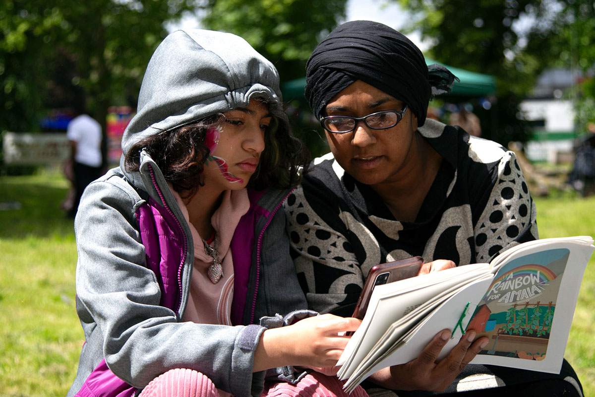 A teenager reading and interacting with her smartphone